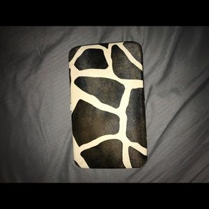 Very pretty flat wallet. No outside pockets.